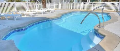 Private pool with fencing and gates. Plenty of outdoor seating and dining