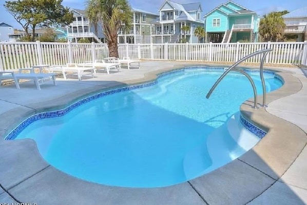 Private pool with fencing and gates. Plenty of outdoor seating and dining