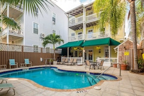 View of the historic Curry House & heated pool from the rear of the property