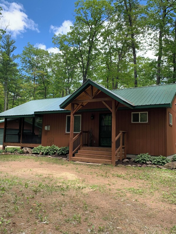 Modern country cabin with large screen porch!