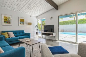 Living room with pool and mountain view