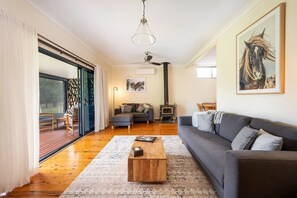 There's plenty of seating in the living room to get cosy and gather around the fireplace.