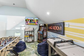 Gameroom - Enjoy a mini foosball table, air hockey, an arcade, and a Roku TV.