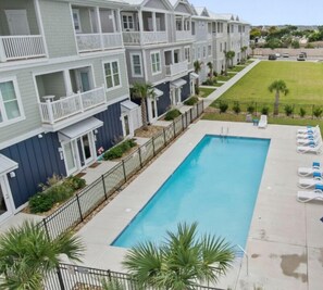 Pool views, beach vibes, and local bars & shops just steps away!  Stay where convenience meets coastal charm.
