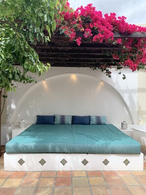 Sunny private courtyard with daybed.