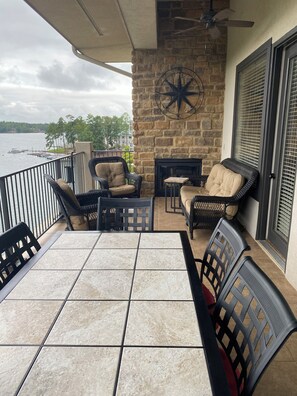 Spacious seating, ceiling fans, lights, and seasonal fireplace.