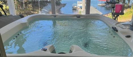 Hot tub on the deck with water view