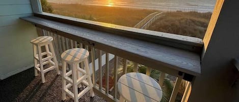 take in the sunrise on the covered porch