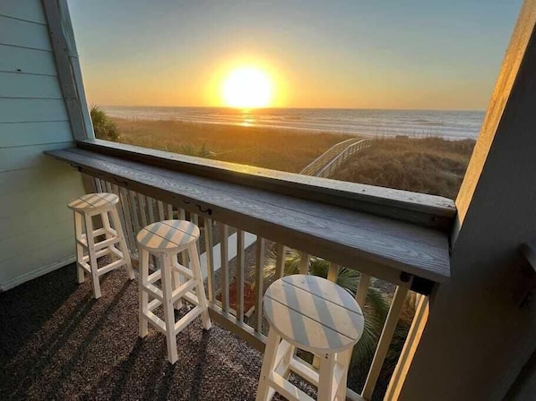 take in the sunrise on the covered porch