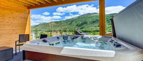 Private hot tub with epic mountain views