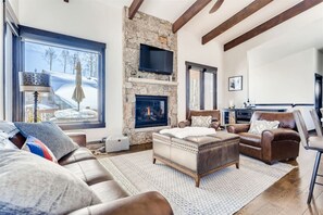 Living Room with fireplace, views, and ample seating