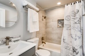 Luxury bathroom with soaps, conditioners, and towels
