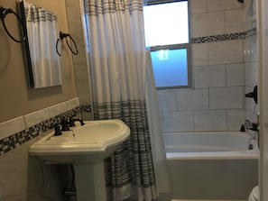 Main bathroom with shower and tub