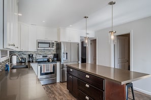 Floor #1 (Condo #1) kitchen which is fully equipped.