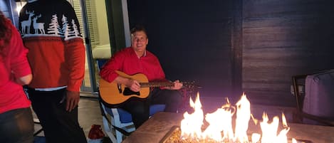 Warm and cozy firepit on the  huge upstairs deck overlooking downtown Austin