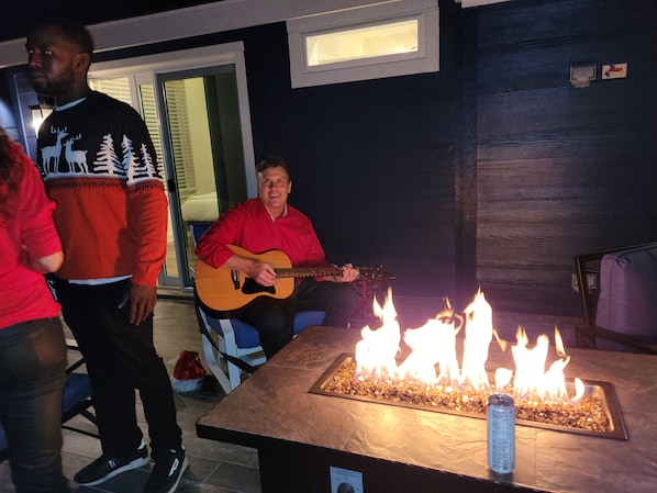 Warm and cozy firepit on the  huge upstairs deck overlooking downtown Austin