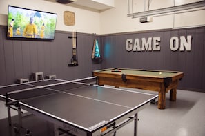 Game room has a pool table, ping pong, boss toss, arcade games, and 75in TV.  Great place to make memories throughout the night 