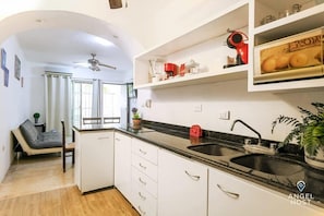 The kitchen opens to the living/dining area; great for interacting together