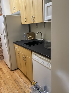 Kitchenette with microwave dishwa and coffee maker
