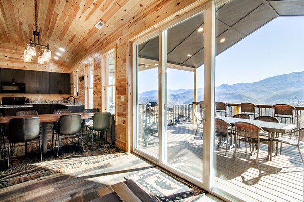 Spacious cabin with stunning views, modern kitchen, and patio.