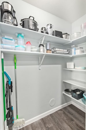 Walk-in pantry stocked with kitchen essentials