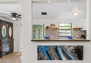 The bar area connects the kitchen and living room.