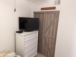 Dresser and closet in room