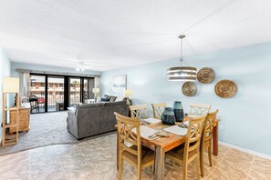 Dining area seamlessly flows into the living room and kitchen area for easy meals and connection.