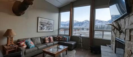 Warm up by the stone fireplace as you take in the scenic views of Electric Peak 