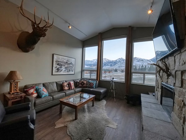 Warm up by the stone fireplace as you take in the scenic views of Electric Peak 