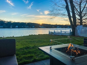 Cozy up by the fire pit and enjoy the lakefront views