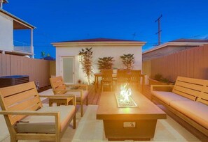 Gather around the fire pit with an evening glass of wine & s'mores