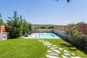 Garden area next to the pool