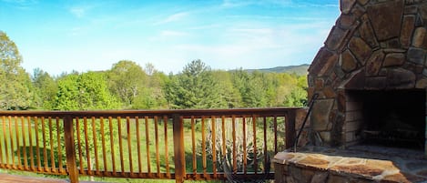 Cabin Fever offers a spacious deck and built in outdoor fireplace perfect for a Carolina Mountain night.