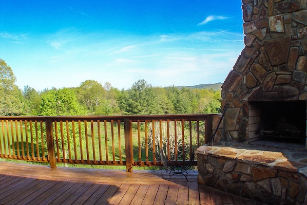 Cabin Fever offers a spacious deck and built in outdoor fireplace perfect for a Carolina Mountain night.