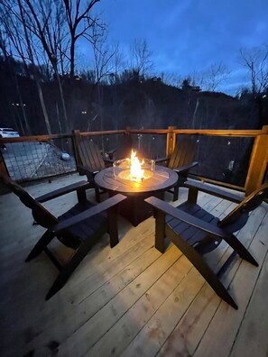 Nighttime is the right time to relax at the fire pit table!