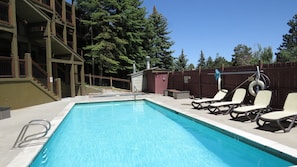 Year round pool deck with poolside lounge chairs