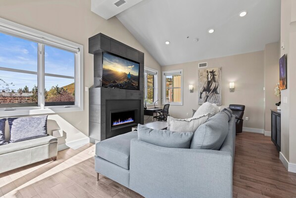 Hardwood floors throughout and comfortable suede sectional in the living room