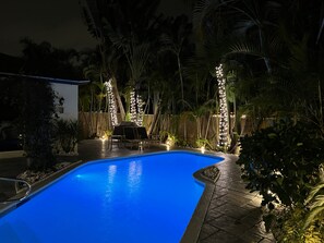 Relaxing outdoors space with landscaping lights throughout 