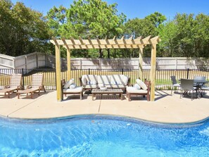 Outside Seating Area - Soak in the sun under the cabana, nestled beside the private pool.