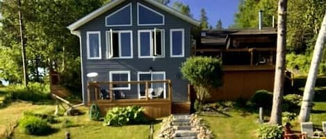 Armour stone steps leading to dock, fire pit and private master bedroom deck 