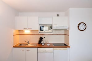 Prepare a meal in the equipped kitchen.
