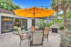 Outdoor dinning and BBQ area with large umbrella so you can eat comfortably and stay out of the sun.