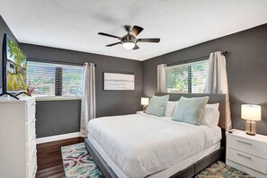 Secondary bedroom with king size bed and flat screen tv.