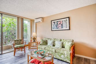 Updated 2nd-floor condo in heart of Kona with lanai, pool, grills