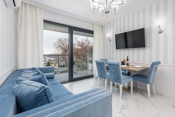 Living room with a comfortable sofa and TV. 