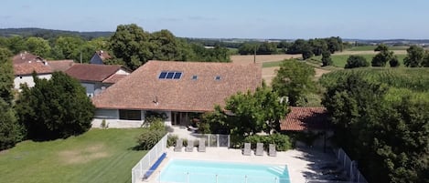 Aerial view of house and pool (and farm buildings).