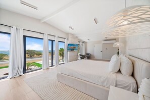Indulge in luxury and comfort in our spacious Ocean view bedroom featuring a plush king-sized bed