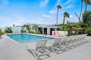 Dive into relaxation at our expansive pool, complete with ample seating options for soaking up the sun's rays.