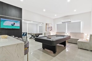 Enjoy a game of pool in our stylish entertainment room.